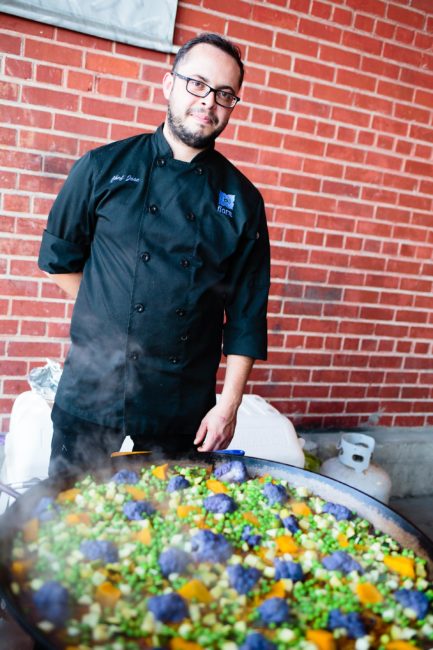 Steaming paella with chef