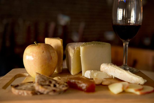 Cheese board and wine glass