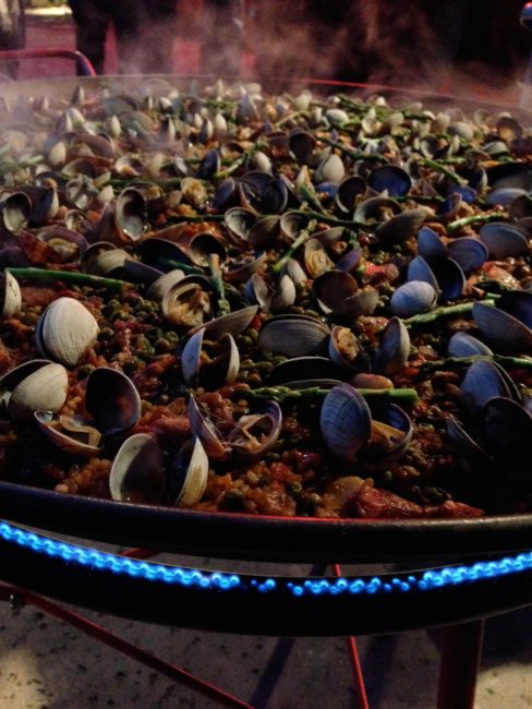 Cooking paella with clams