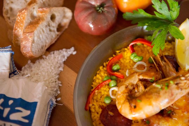 Paella rice, bread, tomatoes and paella